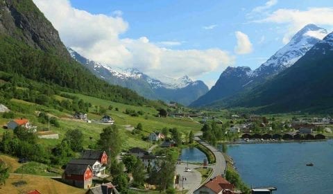 View over the village of Olden in a green valley between the mountains