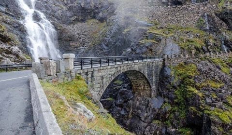 Stone bridge, part of the Troll Road, crossing spectacular Stigfossen waterfall