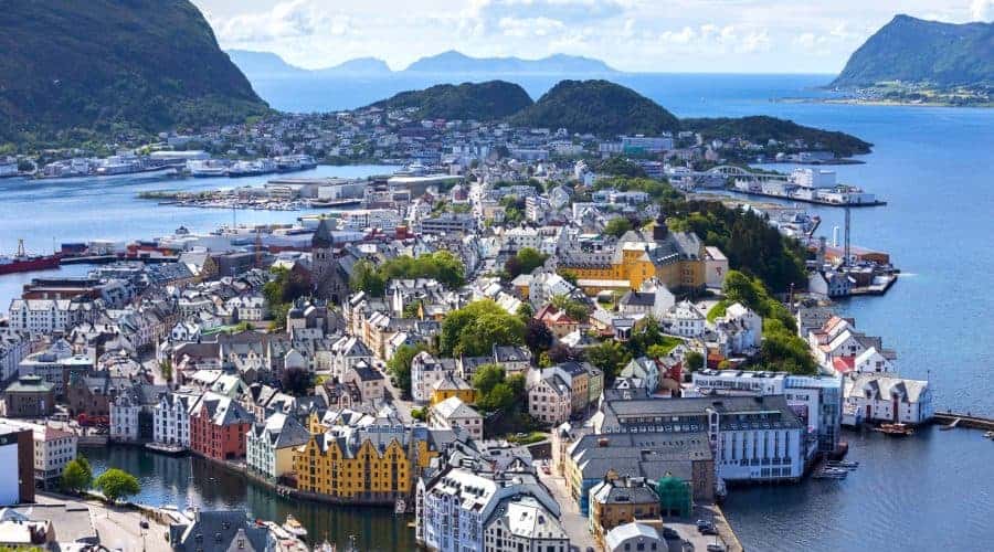 View from Mount Aksla over the center of Ålesund, colourful Art Nouveau buildings on several islands, peacefully surrounded by the Atlantic Ocean