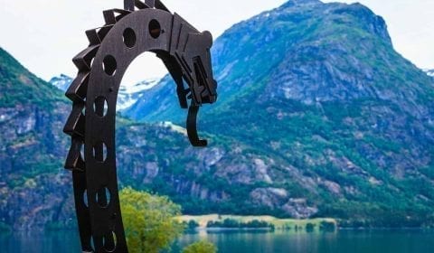 Viking dragon, detail from a viking boat, at the lake of Oppstrynsvatnet on the road to Geiranger, Norway