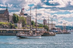 A view of the Akershus Fortress and boats from the water in Oslo, Norway