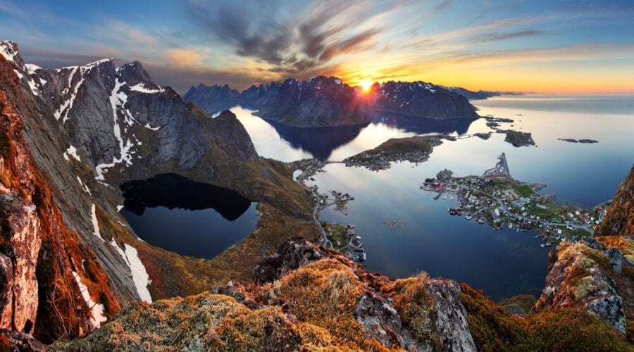 A panoramic view of Lofoten's mountains and sea at sunset