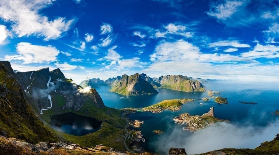 A view of mountains emerging from the ocean in Lofoten, Norway.