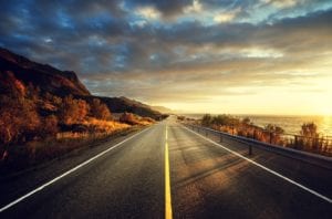 Road by the sea in sunrise time, Lofoten island, Norway.