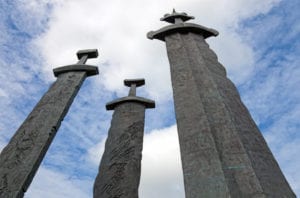 Three large swords stand on the hill as a memory to the Battle of Hafrsfjord in year 872, when King Harald Fairhair gathered all of Norway under one crown. The largest sword represents the victorious king, and the two smaller swords represent the defeated kings.