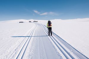 Cross-country skiing on a snowy flat landscape during Easter, Norway.