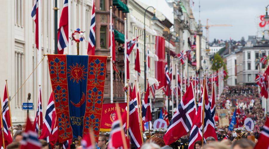 A close up view from the crowd marching in the Syttende Mai parade in Oslo, Norway pre-pandemic.