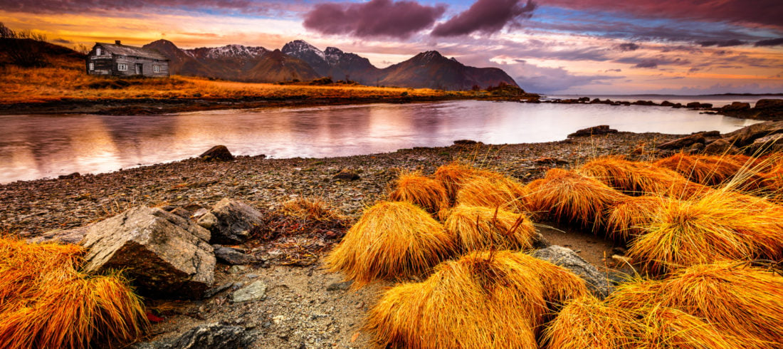 Beautiful fall landscape of Vestvågøy, Norway with a dramatic pink sunset