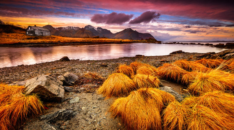 Beautiful fall landscape of Vestvågøy, Norway with a dramatic pink sunset