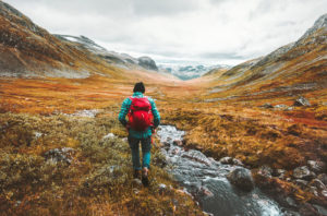 A man hiking in the fall season in Norway