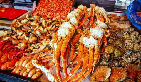 Various seafood on the shelves of the fish market in Bergen, Norway.